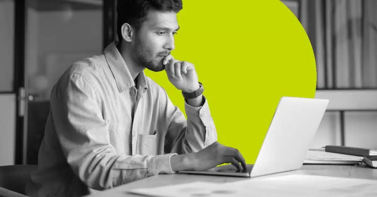 Man reading about the history of email on a laptop.