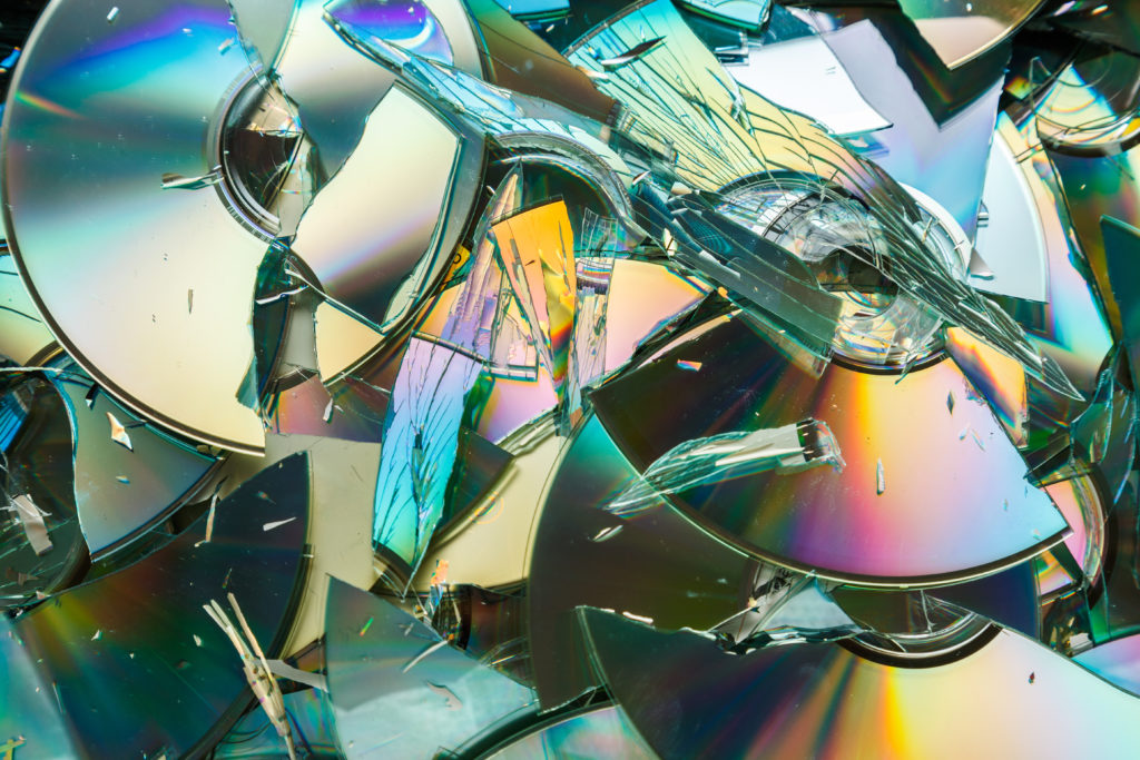 Data destruction: stack of broken CD and DVD disks