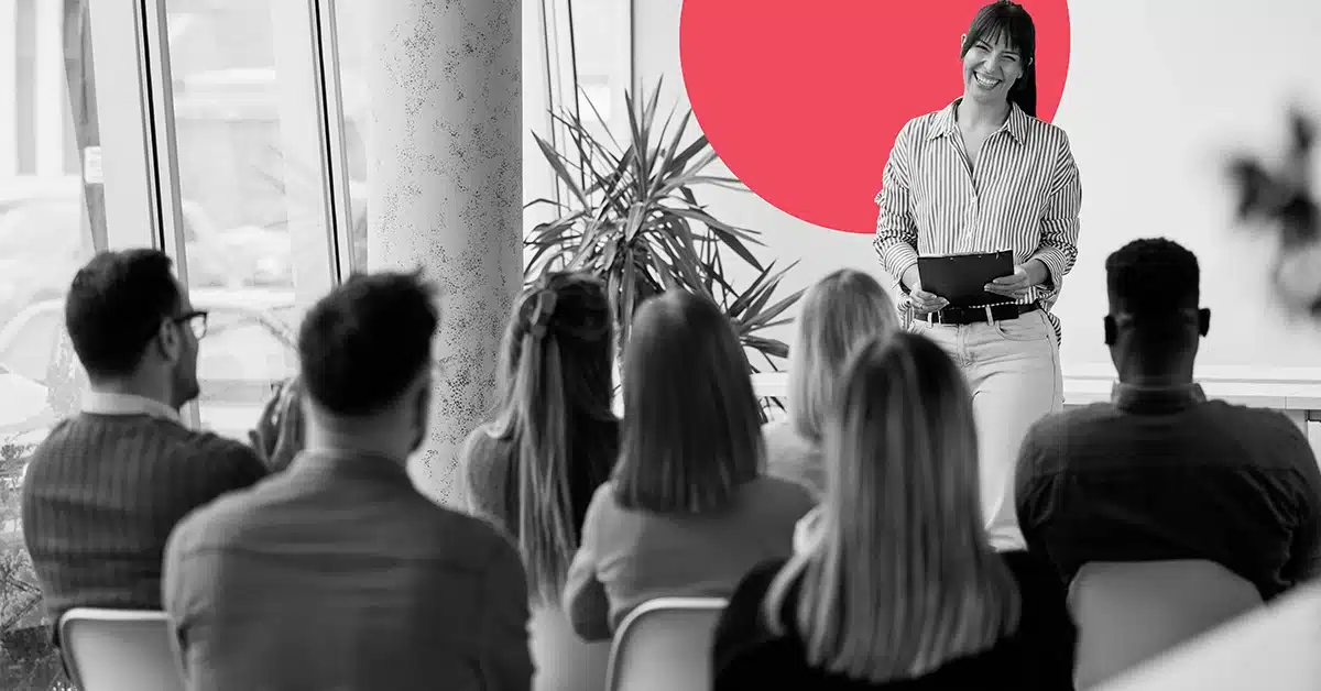 Woman discussing content marketing best practices in front of a group of marketers.