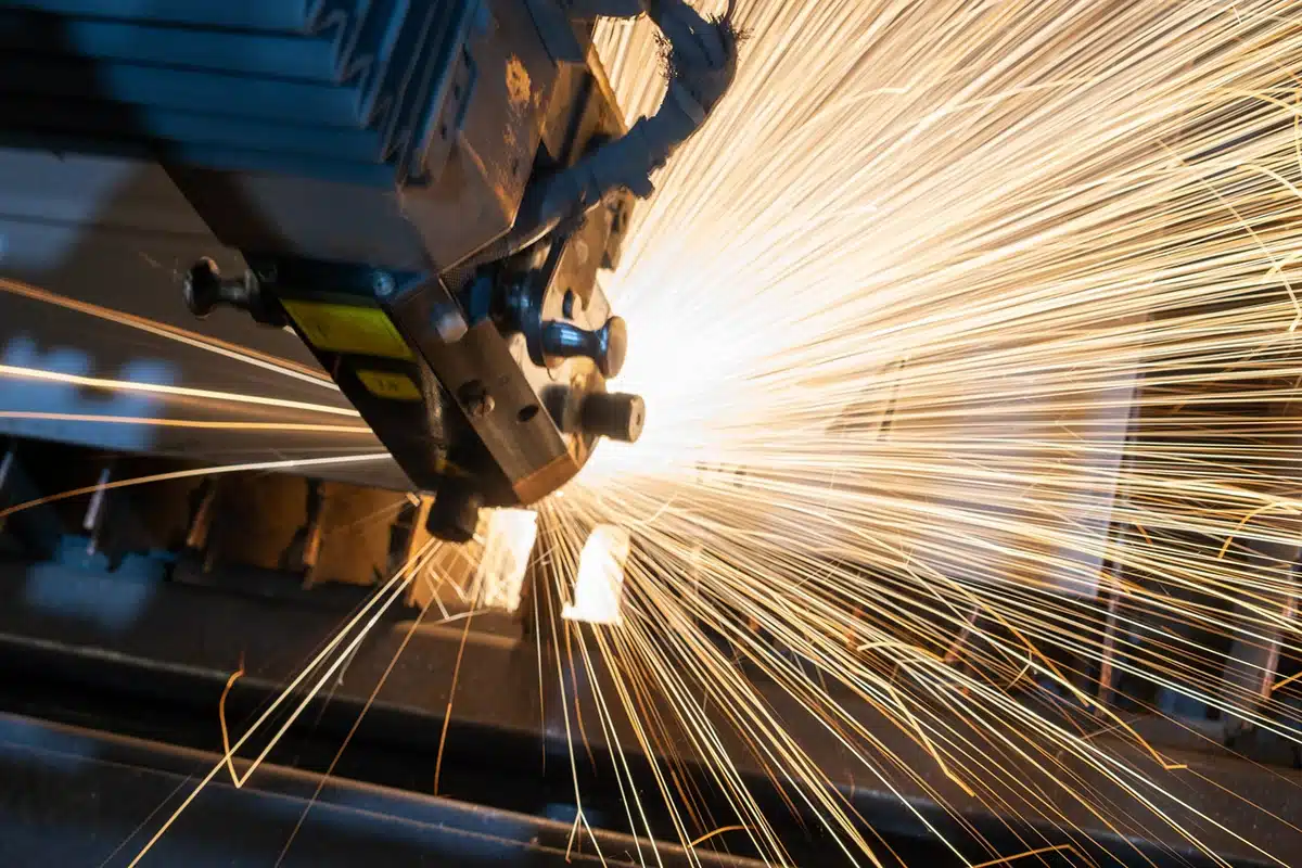 Manufacturing marketing showing a welder with sparks flying.