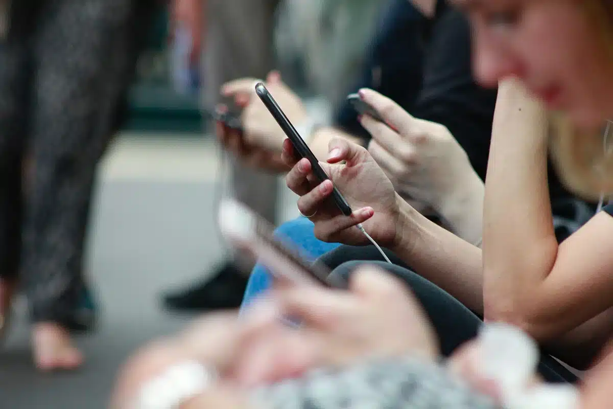 People using their phones while commuting.