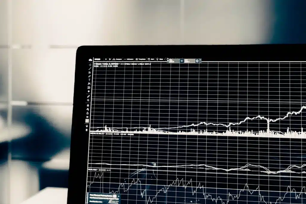 A laptop closeup shows a full screen line graph of a number of leads going up over time.