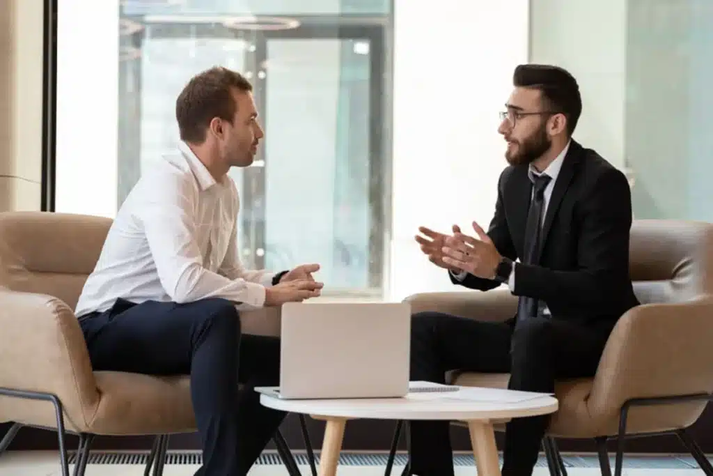 Two businessmen discussing marketing automation for financial services.