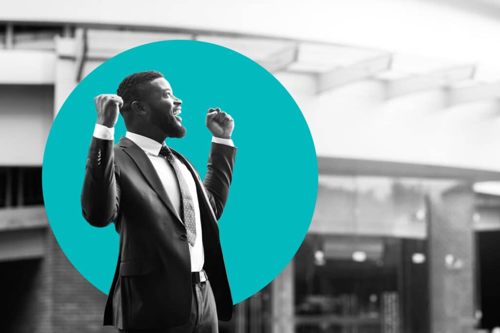 business person pumps fists in victory in a teal circle, illustrating the idea of retention marketing