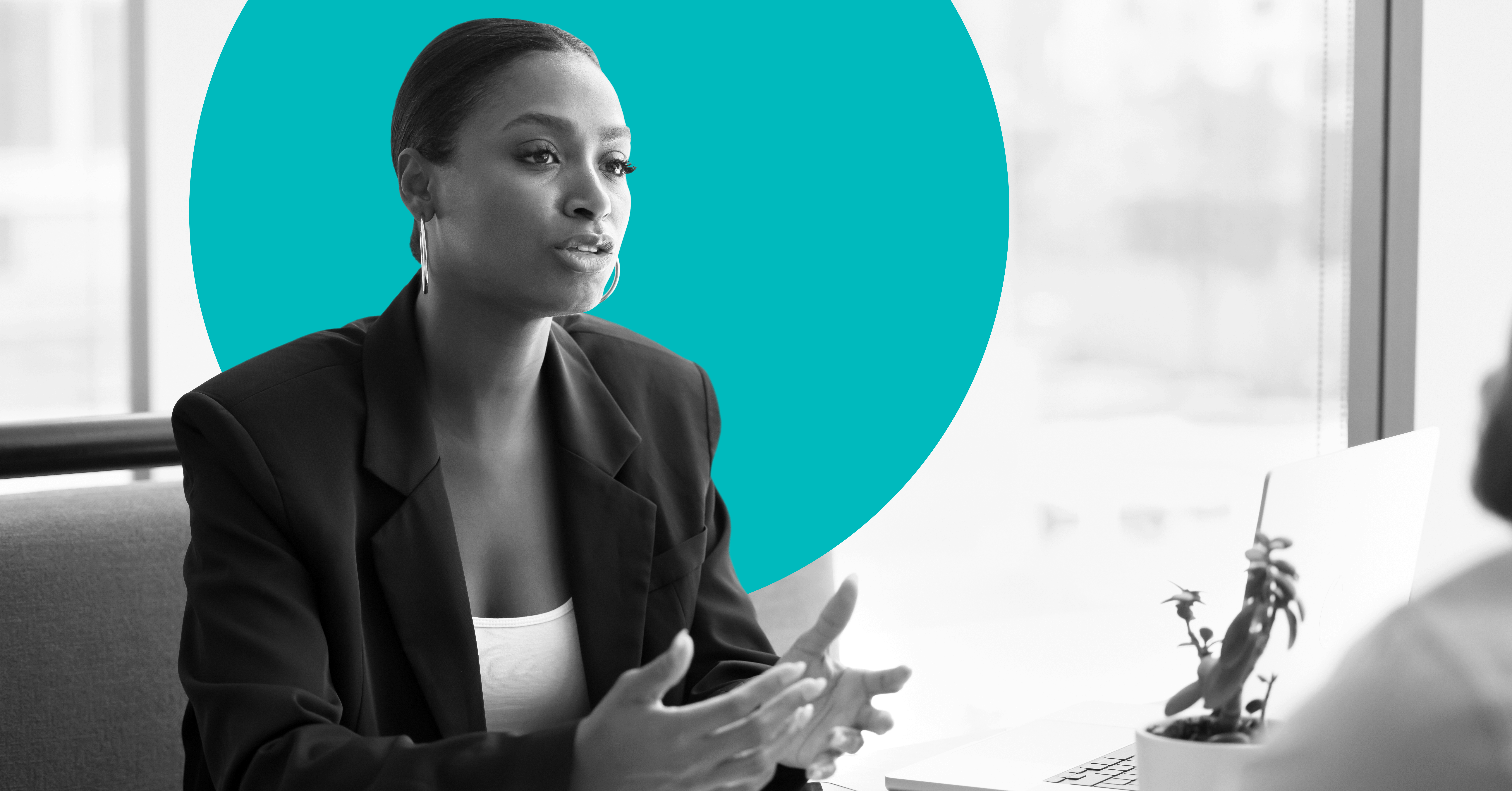 a businesswoman converses with an off camera client to illustrate bank marketing strategy